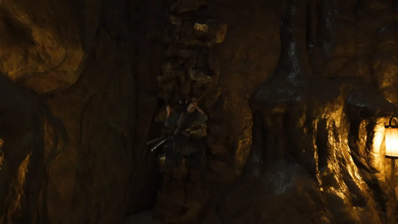 Atsu climbing cliff in the cave - Ghost of Yotei The Spider Lilly General